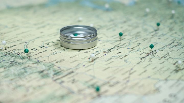 silver ring on white and blue textile